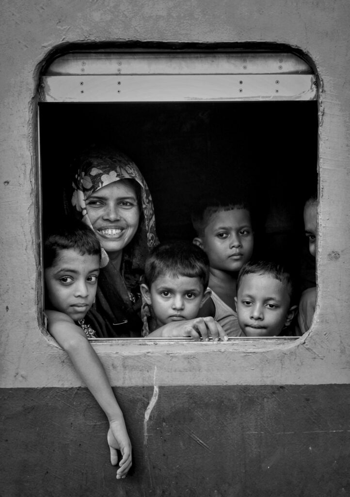 Kids traveling on the train in Sri Lanka